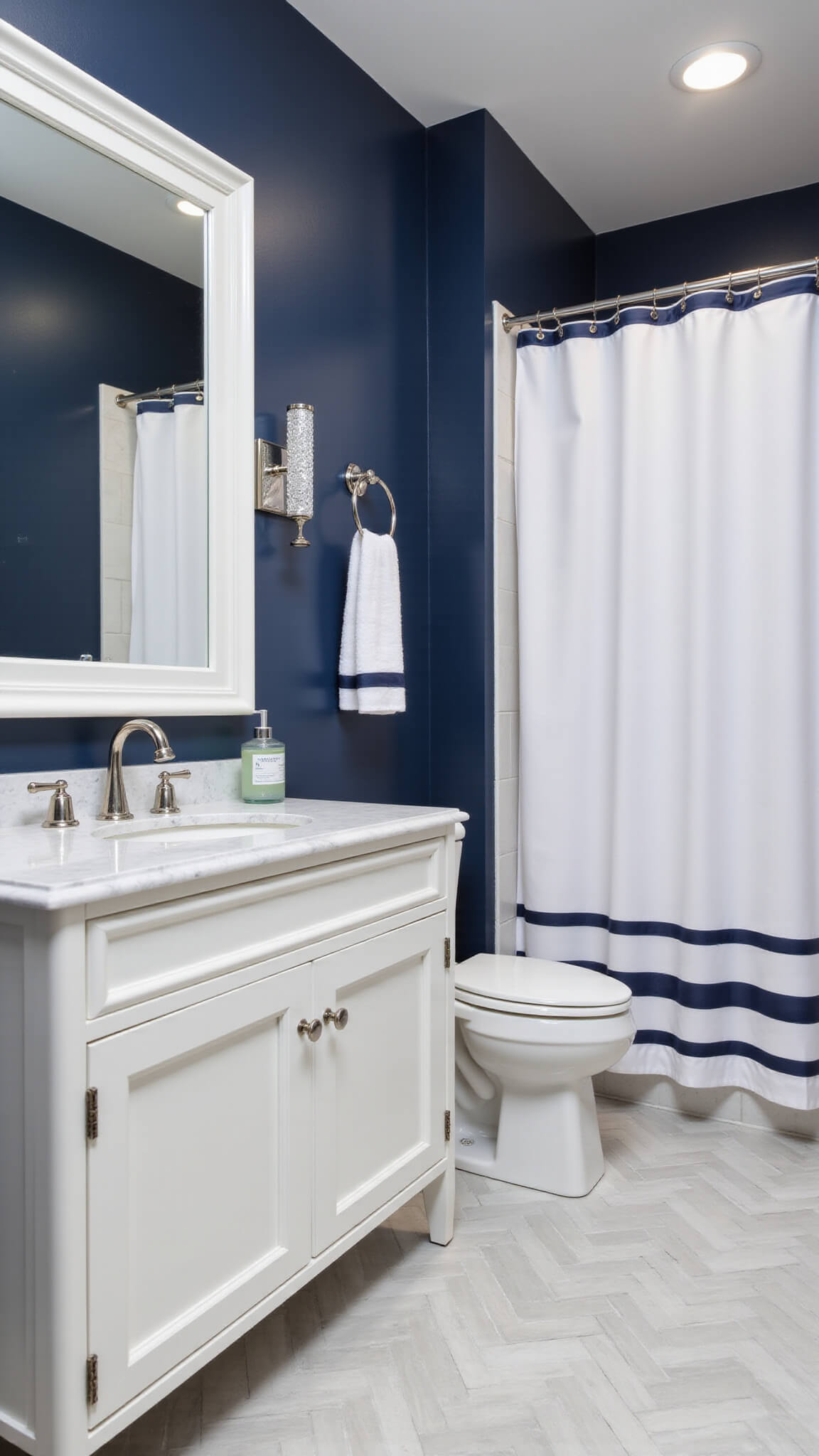 Elegant 5x8' bathroom with Adriatic Sea navy walls, white trim, marble vanity, herringbone floor, and polished nickel fixtures.