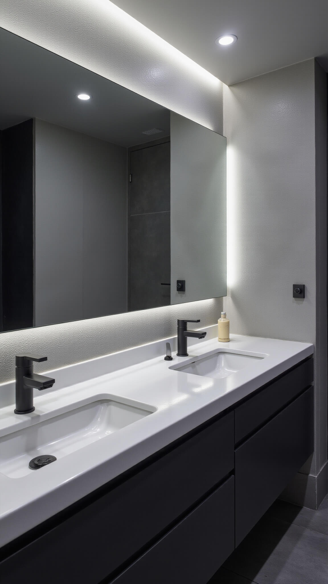 High-tech minimalist bathroom with smart mirror, floating vanity, and touchless matte black faucets under LED spectrum lighting at dusk.